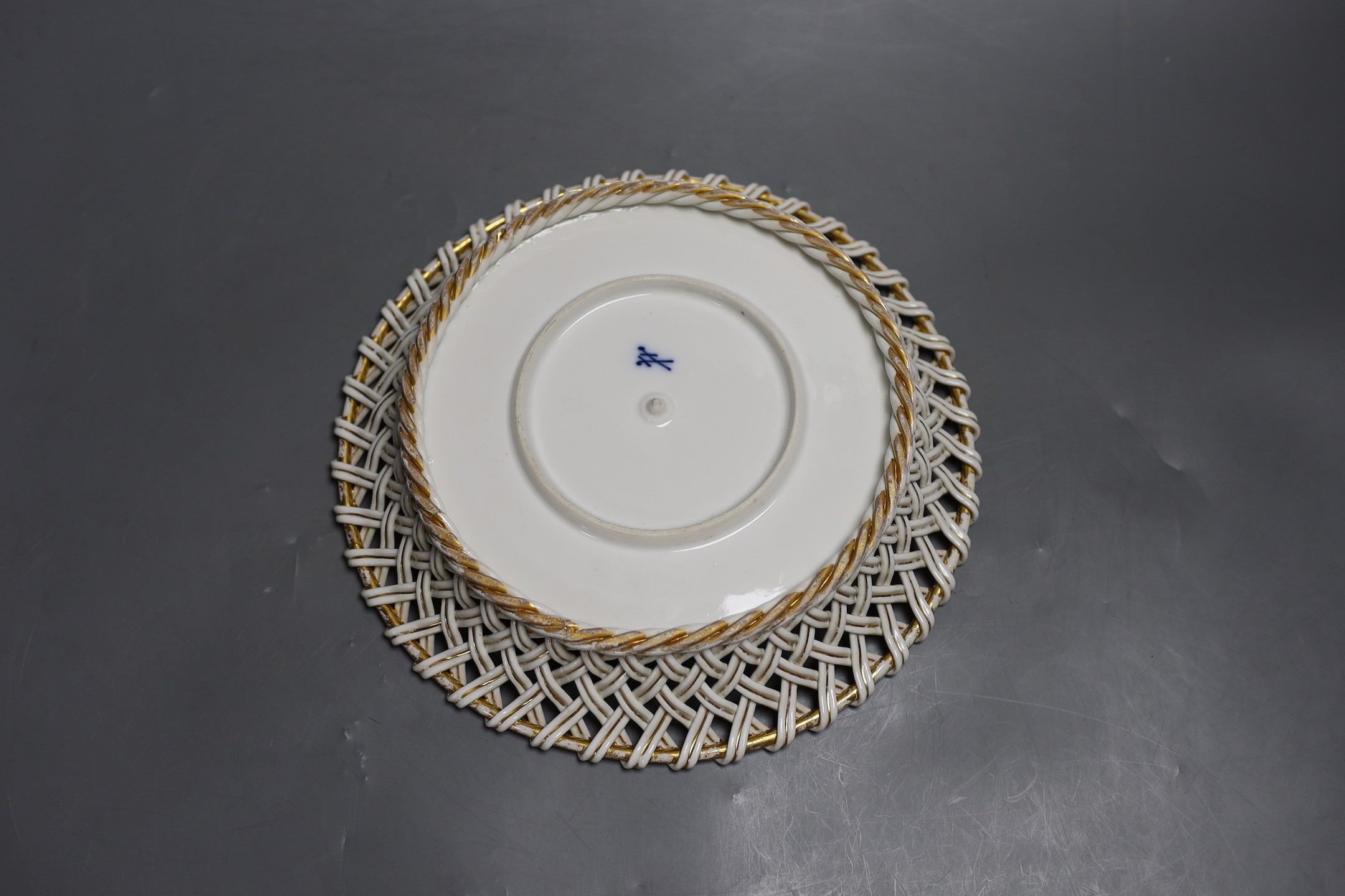 A late 19th century Meissen circular basket border dish with flower decoration, 26cm diameter